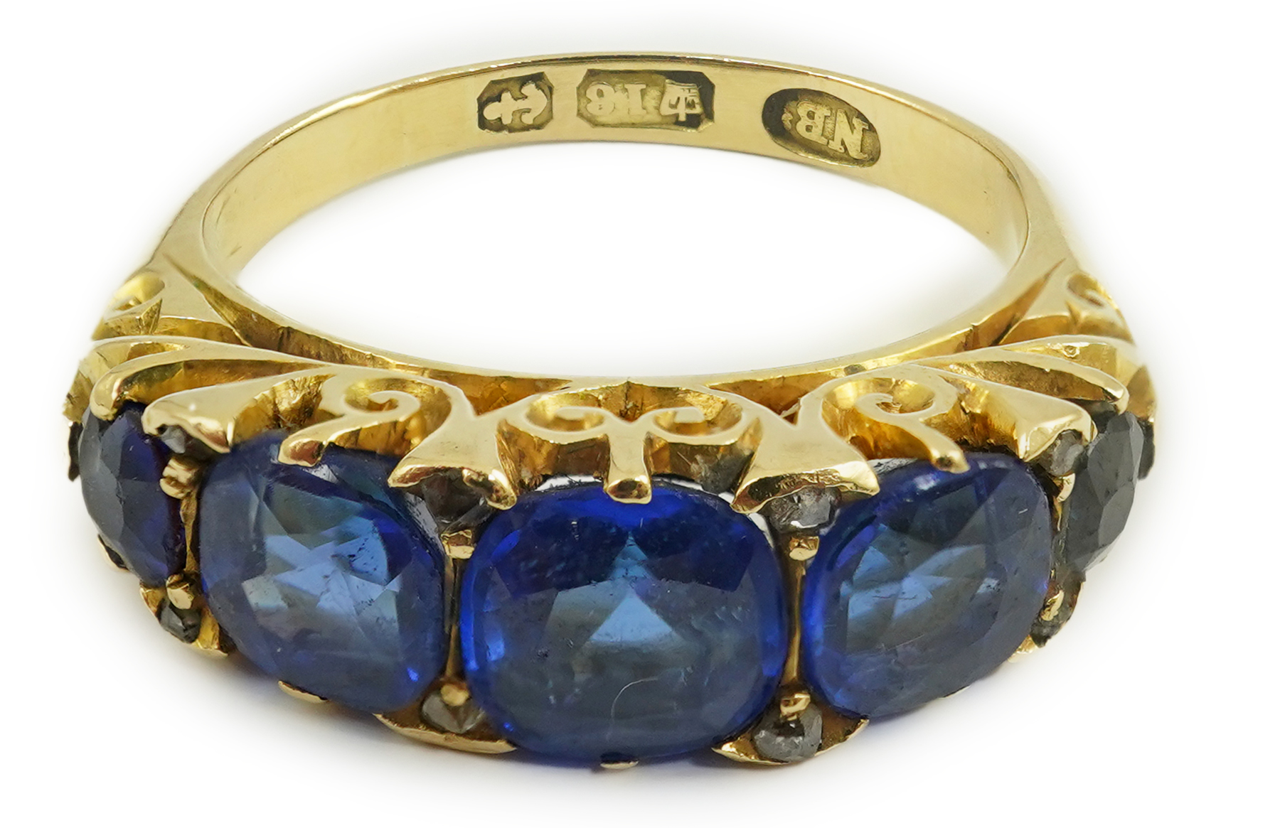 A late Victorian 18ct gold and graduated five stone blue doublet set half hoop ring